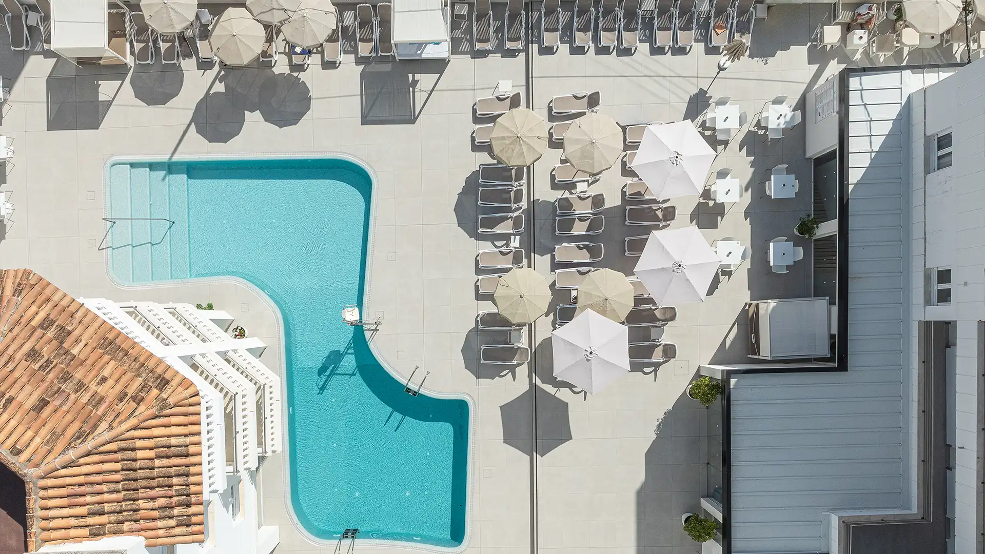 Pool and restaurant terrace at Welikehotel Triton Beach